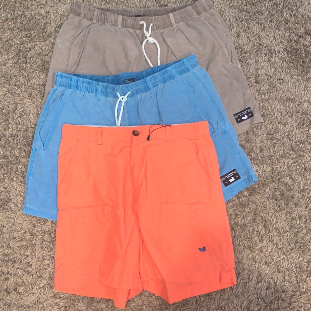 Mens medium southern marsh shorts, 1 aqua blue, 1 orange, and 1 khaki